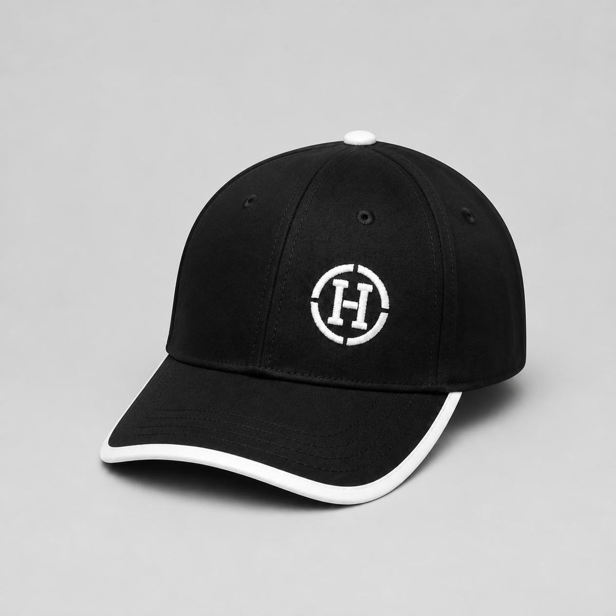 Black Six-Panel Cap with White Embroidered Circle Logo and Contrast Brim Trim