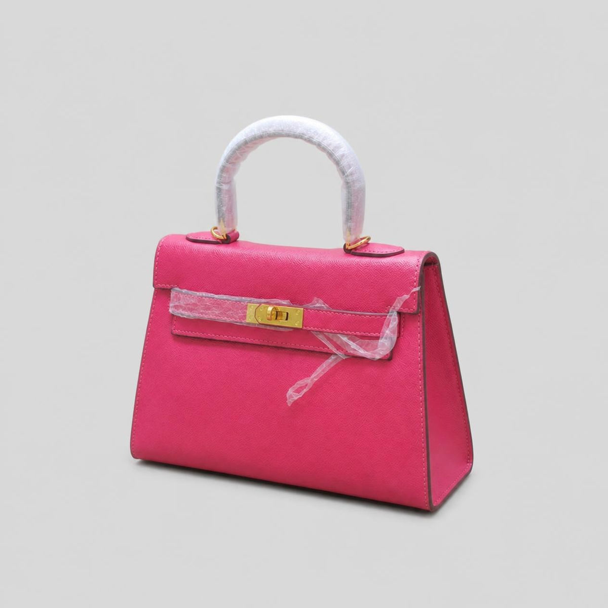 Hot Pink Textured Mini Top-Handle Bag with Gold Turn-Lock Closure