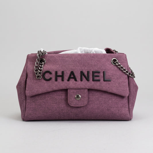 Women’s Mauve Purple Washed Denim-Look Flap Shoulder Bag with Chain Straps and Black Lettering Detail